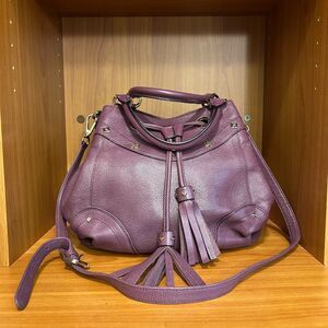 MCM Purple Crossbody Bag with Adjustable Strap and Tassel